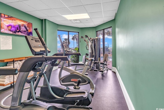 gym featuring a drop ceiling