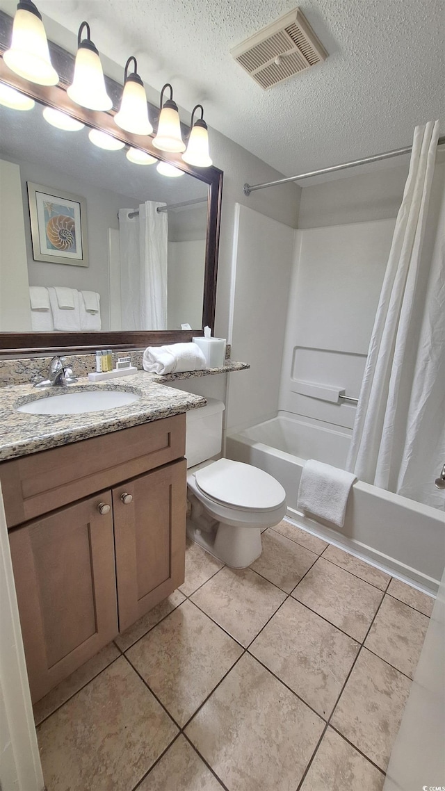 2700 N Ocean Blvd Unit 1854, Myrtle Beach, SC 29577 - full bathroom with shower / tub combo, a textured ceiling, vanity, toilet, and tile patterned floors