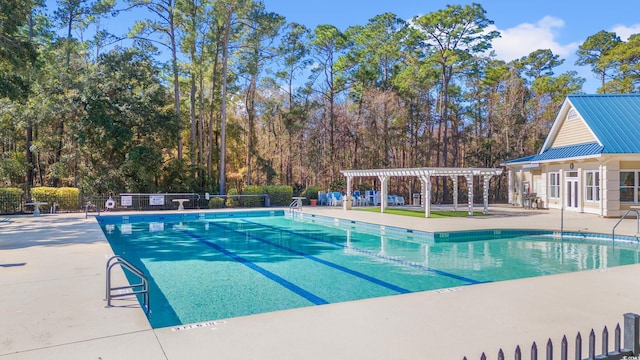 view of pool with a pergola and a patio area