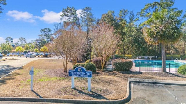 view of property's community with a swimming pool