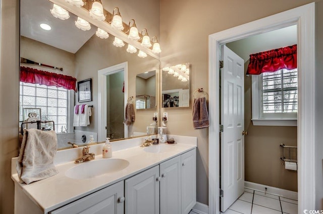 bathroom featuring tile patterned flooring and vanity