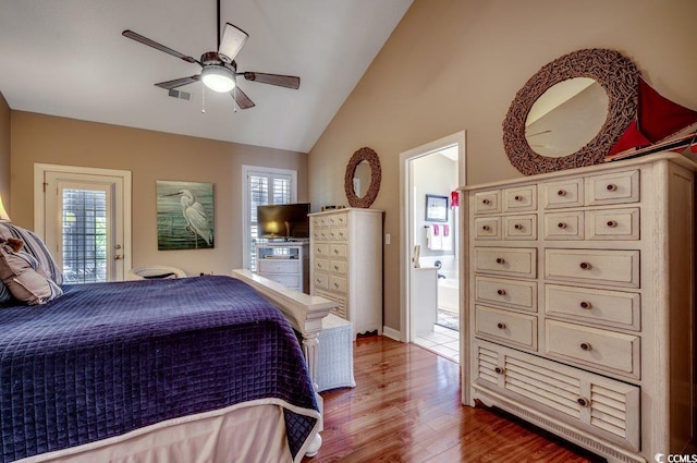 bedroom with hardwood / wood-style floors, lofted ceiling, ceiling fan, and access to exterior