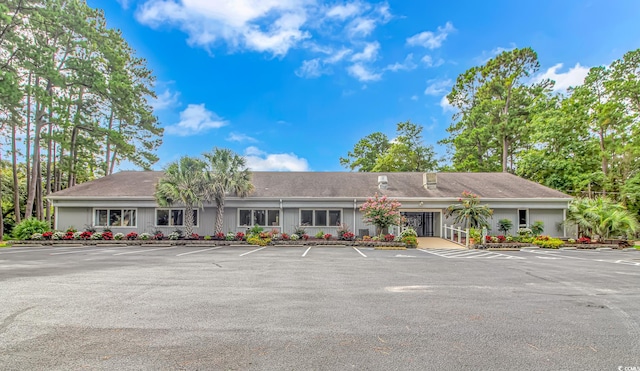 view of front of house with uncovered parking