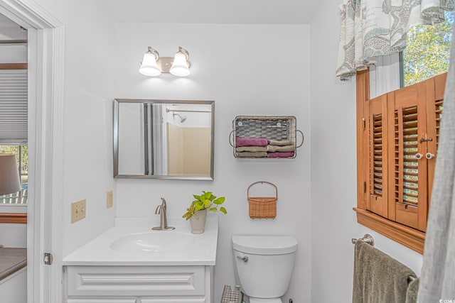 bathroom with toilet and vanity