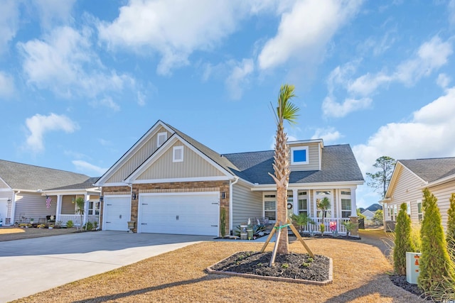 view of front of home with concrete driveway, an attached garage, and a shingled roof