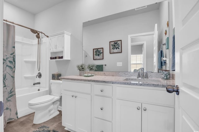 full bathroom with tile patterned flooring, visible vents, toilet, shower / bath combo with shower curtain, and vanity