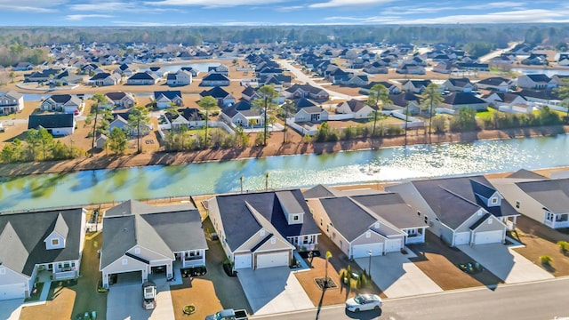 bird's eye view featuring a residential view and a water view