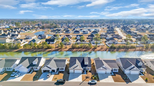 aerial view with a residential view and a water view