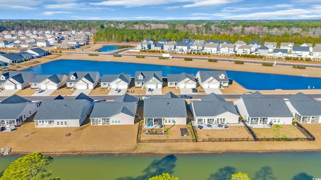 aerial view featuring a residential view and a water view