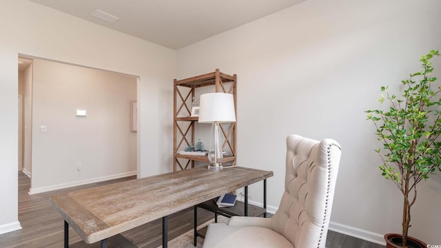 office space with dark hardwood / wood-style flooring