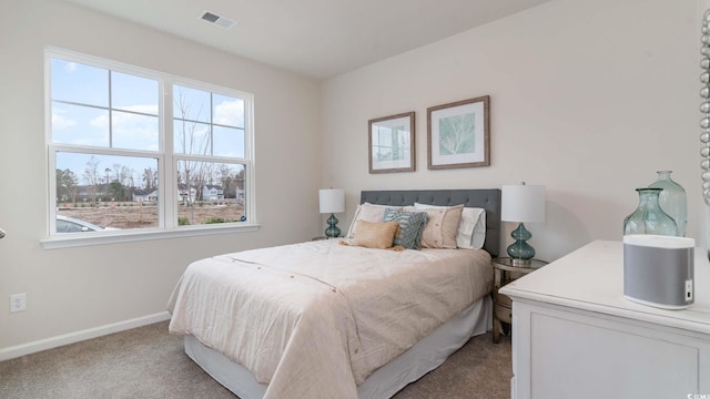 bedroom with light carpet