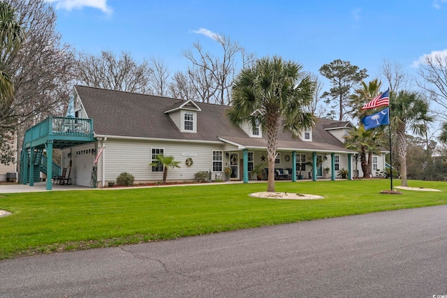 view of front of house featuring a front lawn, concrete driveway, roof with shingles, and an attached garage