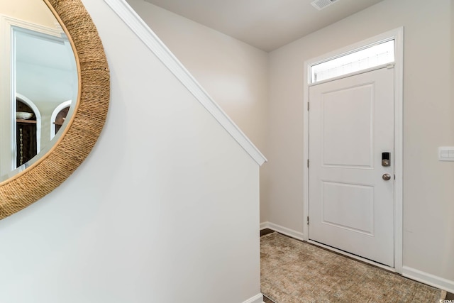 entryway with visible vents and baseboards