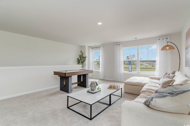 living area with light carpet, baseboards, and recessed lighting