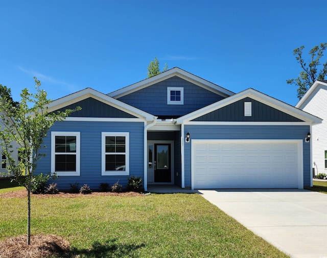 327 Dunlin Pl, Conway, SC 29526 - view of front of property featuring a garage, a front lawn, and concrete driveway