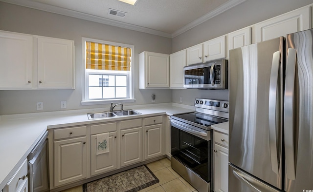 6015 Catalina Dr Unit 734, North Myrtle Beach, SC 29582 - kitchen with stainless steel appliances, a sink, white cabinetry, crown molding, and light tile patterned floors