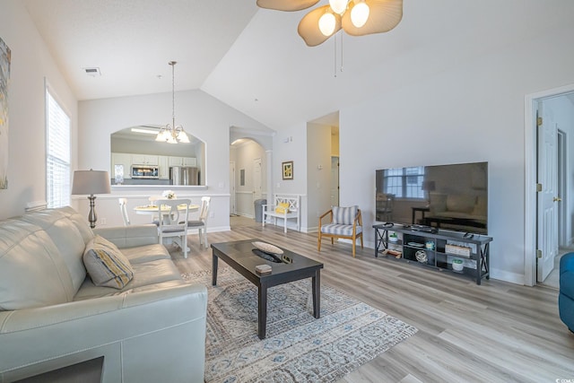 6015 Catalina Dr Unit 734, North Myrtle Beach, SC 29582 - living area featuring arched walkways, a ceiling fan, light wood finished floors, baseboards, and high vaulted ceiling
