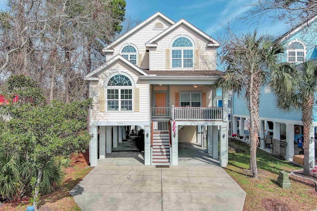 coastal home with covered porch and a carport