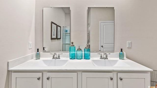 bathroom with double vanity and a sink
