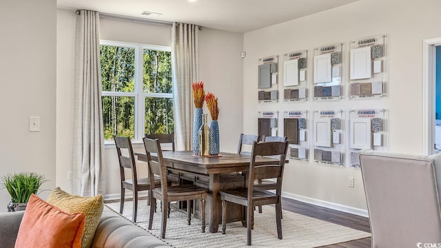 dining room with wood finished floors and baseboards