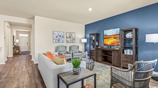 living room featuring baseboards and wood finished floors