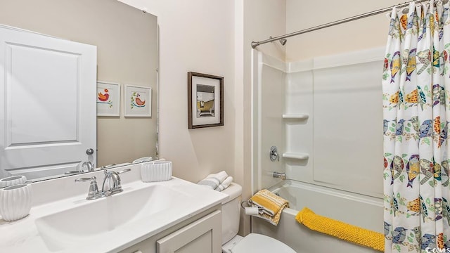 bathroom with shower / tub combo, toilet, and vanity
