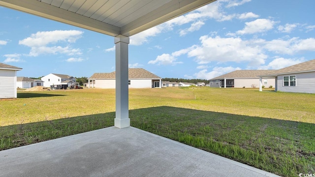 view of yard with a patio area and a residential view