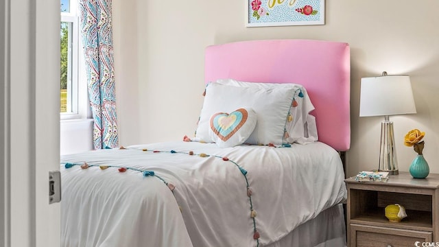 bedroom featuring multiple windows