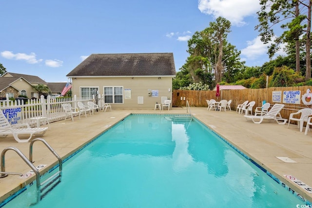 view of pool featuring a patio