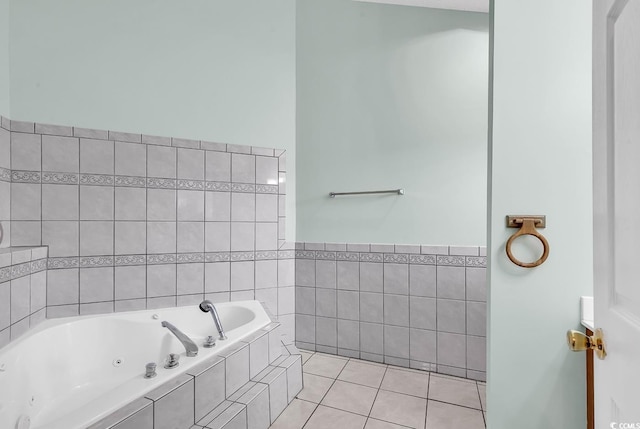 bathroom with tile patterned floors, tiled bath, and tile walls