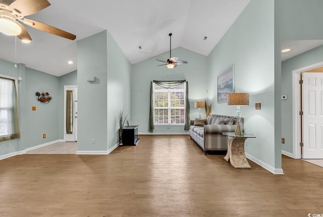 sitting room with light hardwood / wood-style floors, lofted ceiling, and ceiling fan