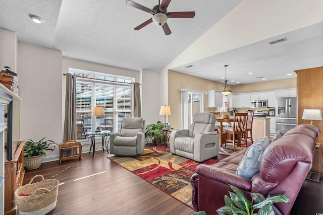 118 Gully Branch Ln Unit 3, Myrtle Beach, SC 29572 - living room featuring ceiling fan, a textured ceiling, lofted ceiling, visible vents, and dark wood-style floors