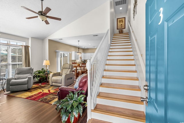 118 Gully Branch Ln Unit 3, Myrtle Beach, SC 29572 - stairs featuring a textured ceiling, wood finished floors, visible vents, a ceiling fan, and vaulted ceiling