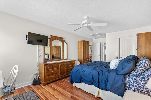118 Gully Branch Ln Unit 3, Myrtle Beach, SC 29572 - bedroom featuring light wood-style flooring, attic access, ceiling fan, a textured ceiling, and baseboards