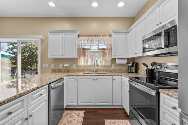 118 Gully Branch Ln Unit 3, Myrtle Beach, SC 29572 - kitchen with stainless steel appliances, white cabinets, a sink, and light stone countertops