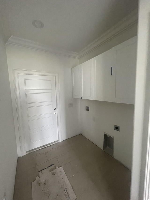 washroom featuring electric dryer hookup, cabinet space, and crown molding
