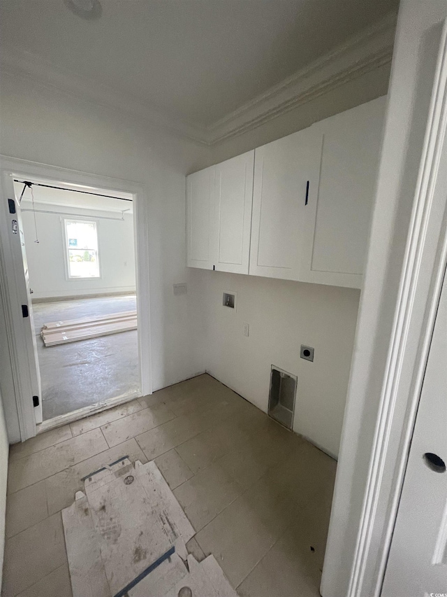 washroom featuring crown molding, cabinet space, electric dryer hookup, and hookup for a washing machine