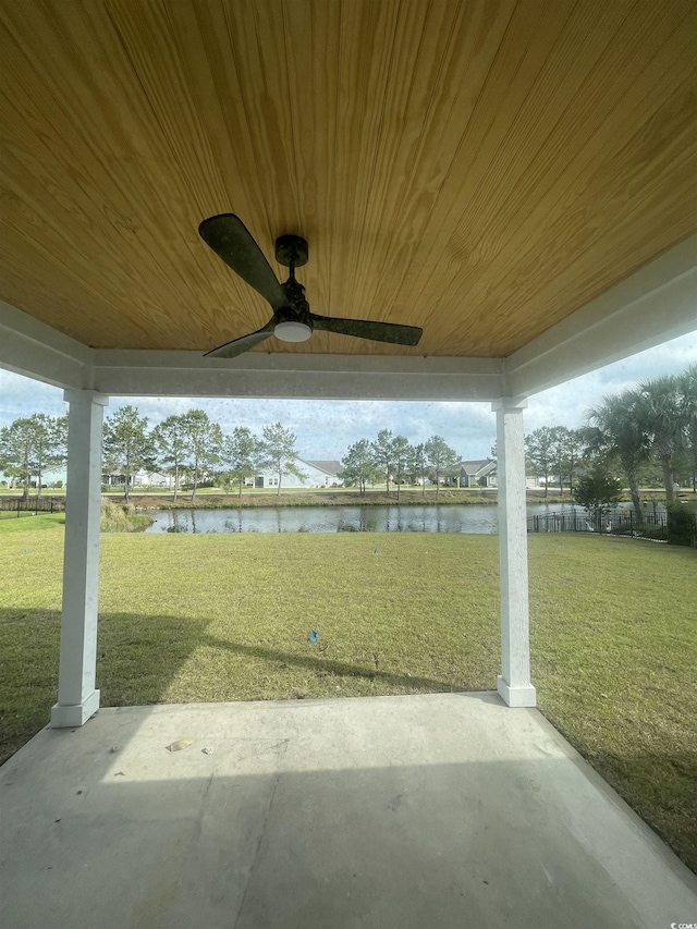 view of patio / terrace with a water view and ceiling fan