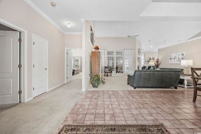 living room featuring crown molding, lofted ceiling, a ceiling fan, light carpet, and baseboards