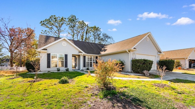 ranch-style home with a garage and a front yard