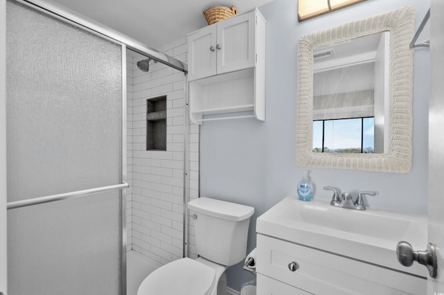 bathroom with vanity, toilet, and walk in shower