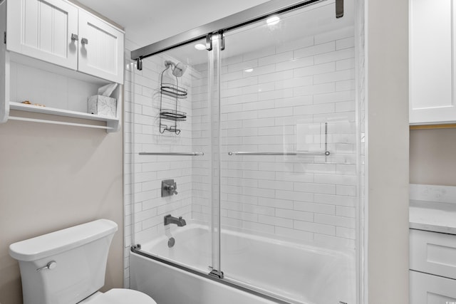 bathroom featuring toilet and enclosed tub / shower combo