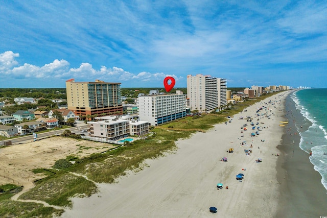 aerial view featuring a water view and a beach view