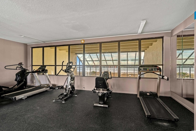 exercise room featuring a textured ceiling