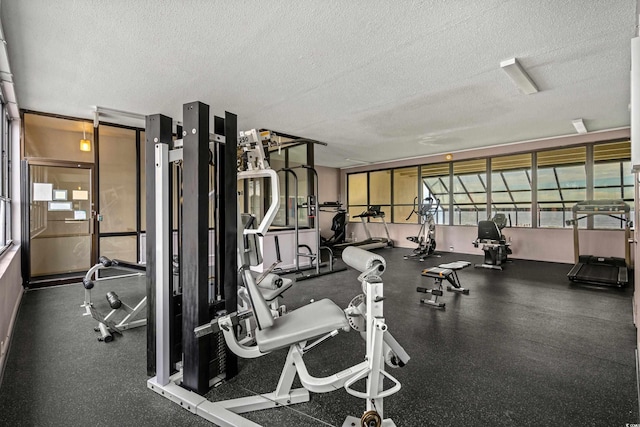 workout area featuring a textured ceiling