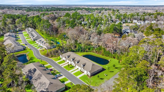 drone / aerial view featuring a water view and a residential view