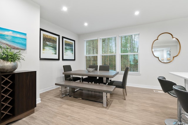 dining area featuring light wood-type flooring