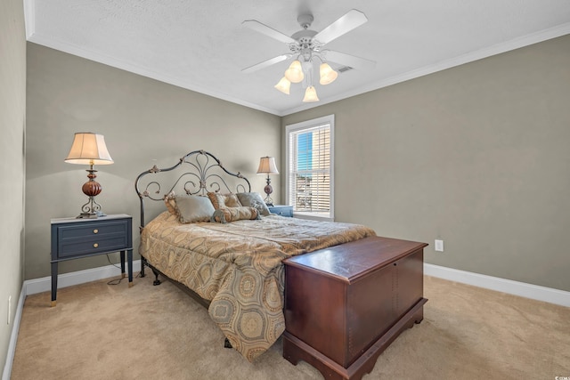 carpeted bedroom featuring ceiling fan and crown molding