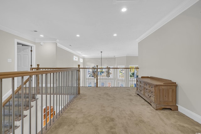 hallway featuring crown molding and carpet floors