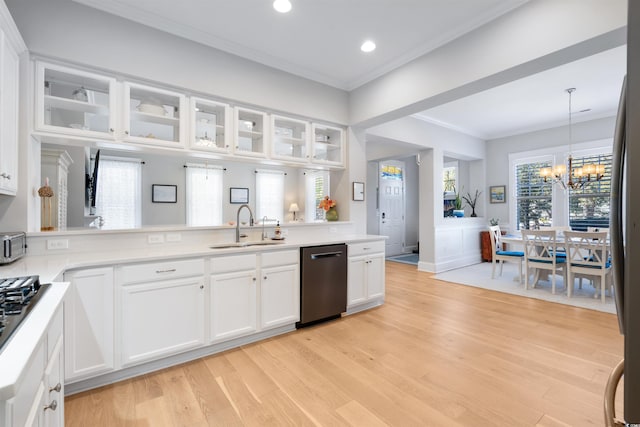 kitchen featuring white cabinets, kitchen peninsula, dishwasher, and sink